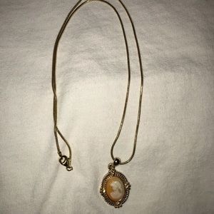 24 karat gold necklace with antique charm